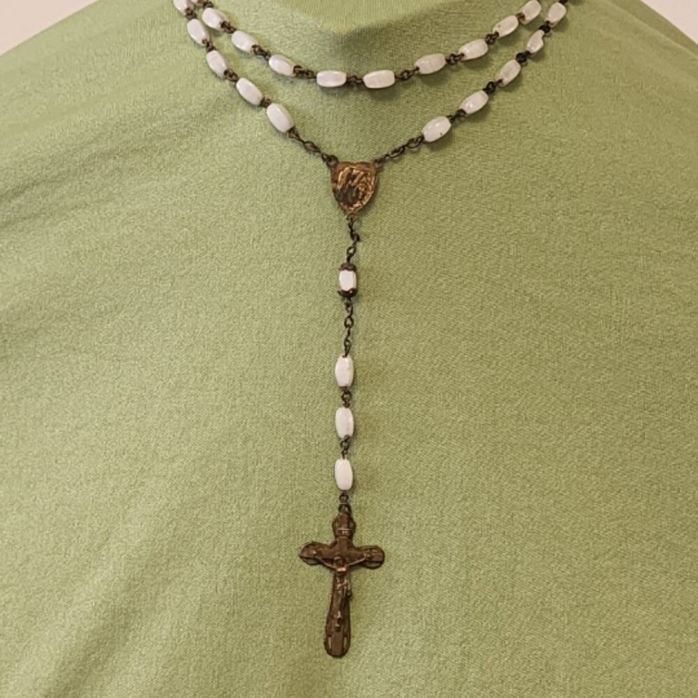 White oval  shaped-faceted white catholic rosary